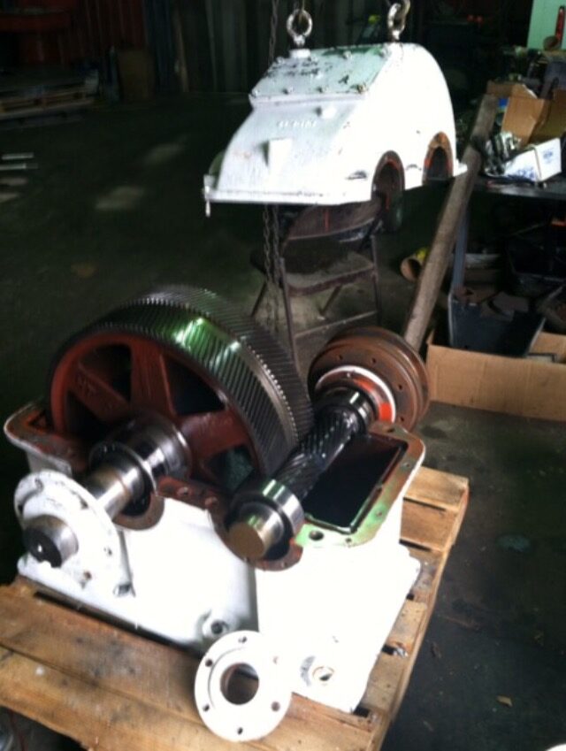 A bull gear and pinion set rigged for assembly