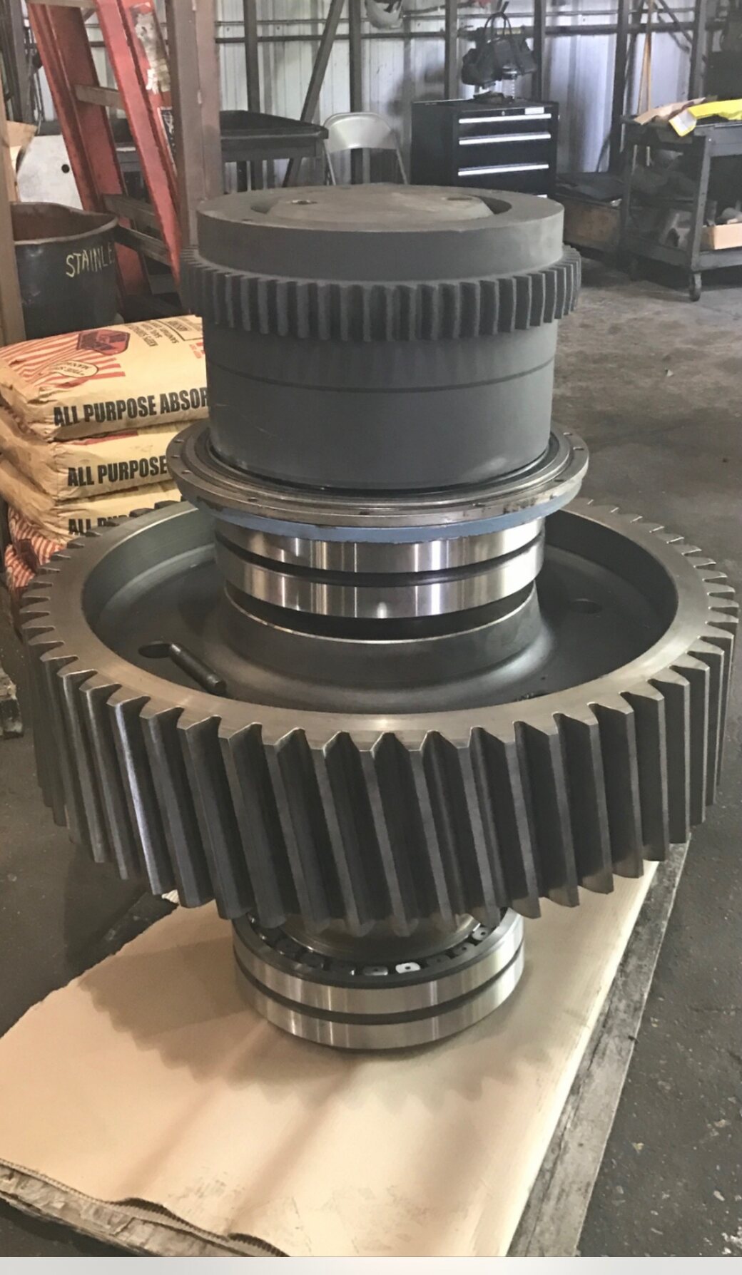 A large reconditioned bull gear and pinion assembly seated on new bearings during a gearbox rebuild at Solution Gear Co.
