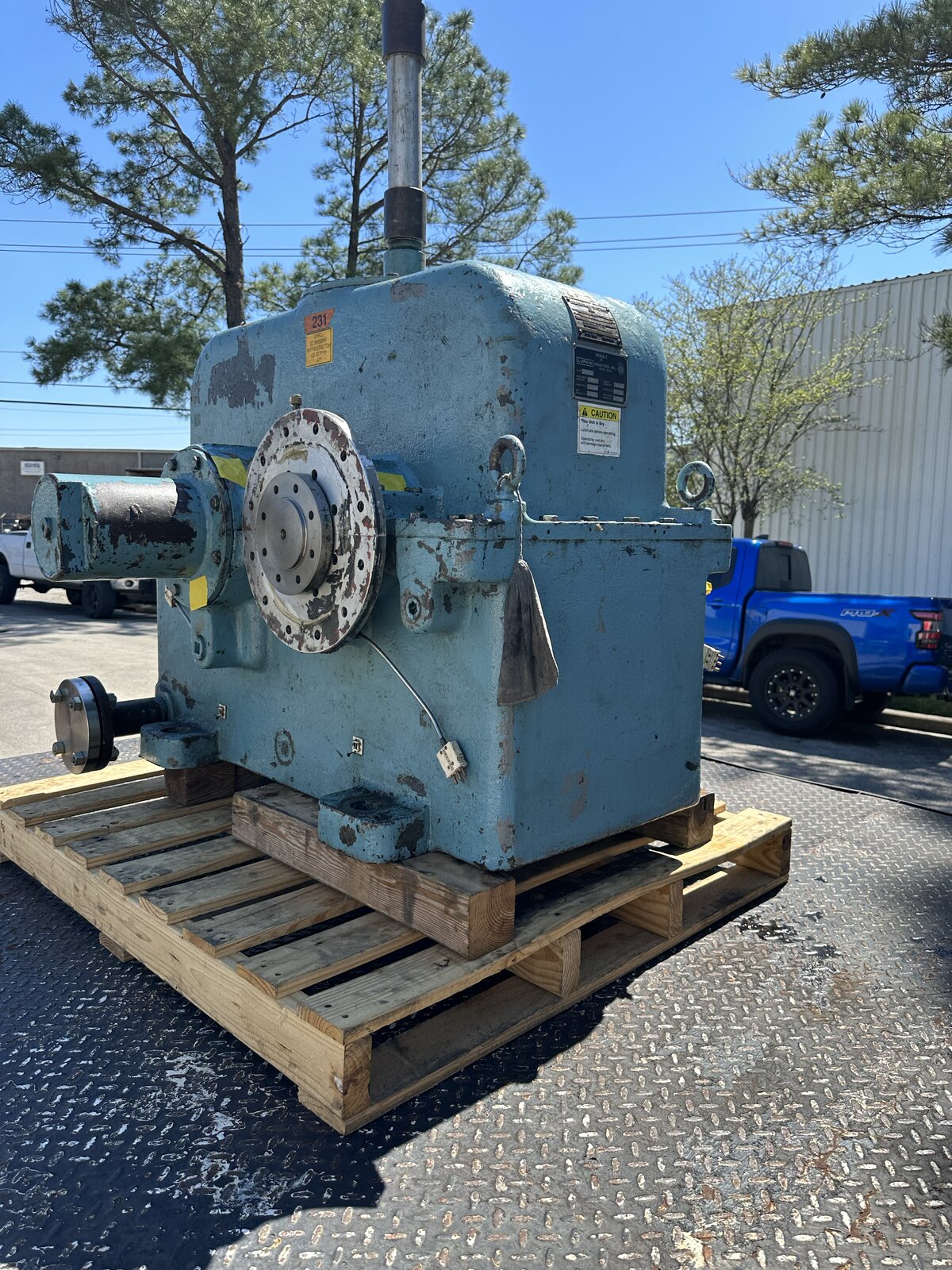 Worn planetary gear set with chipped sun and planet gear teeth before repair