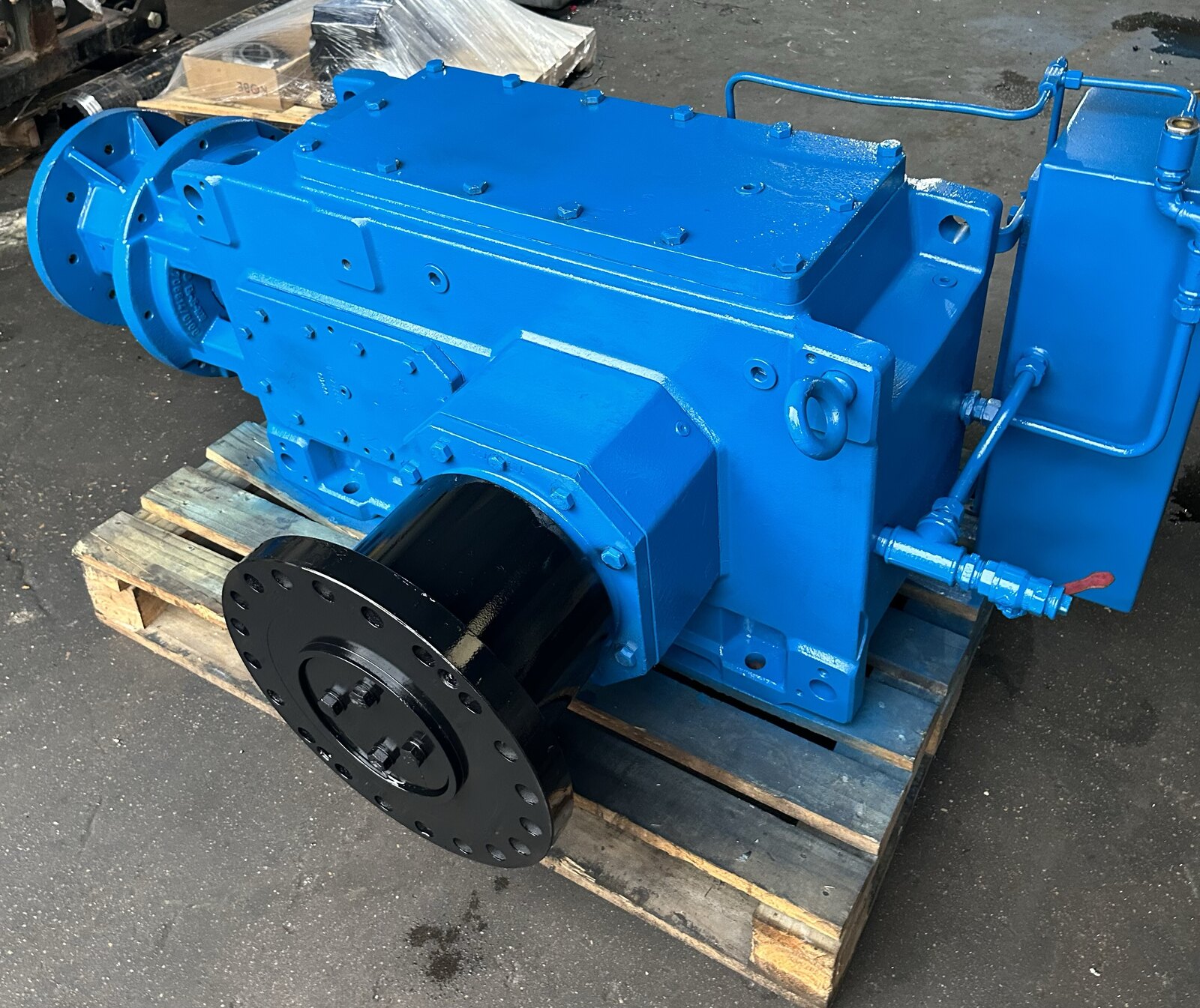 A rebuilt blue gearbox with a black cup, after reconditioning in the Solution Gear Houston shop