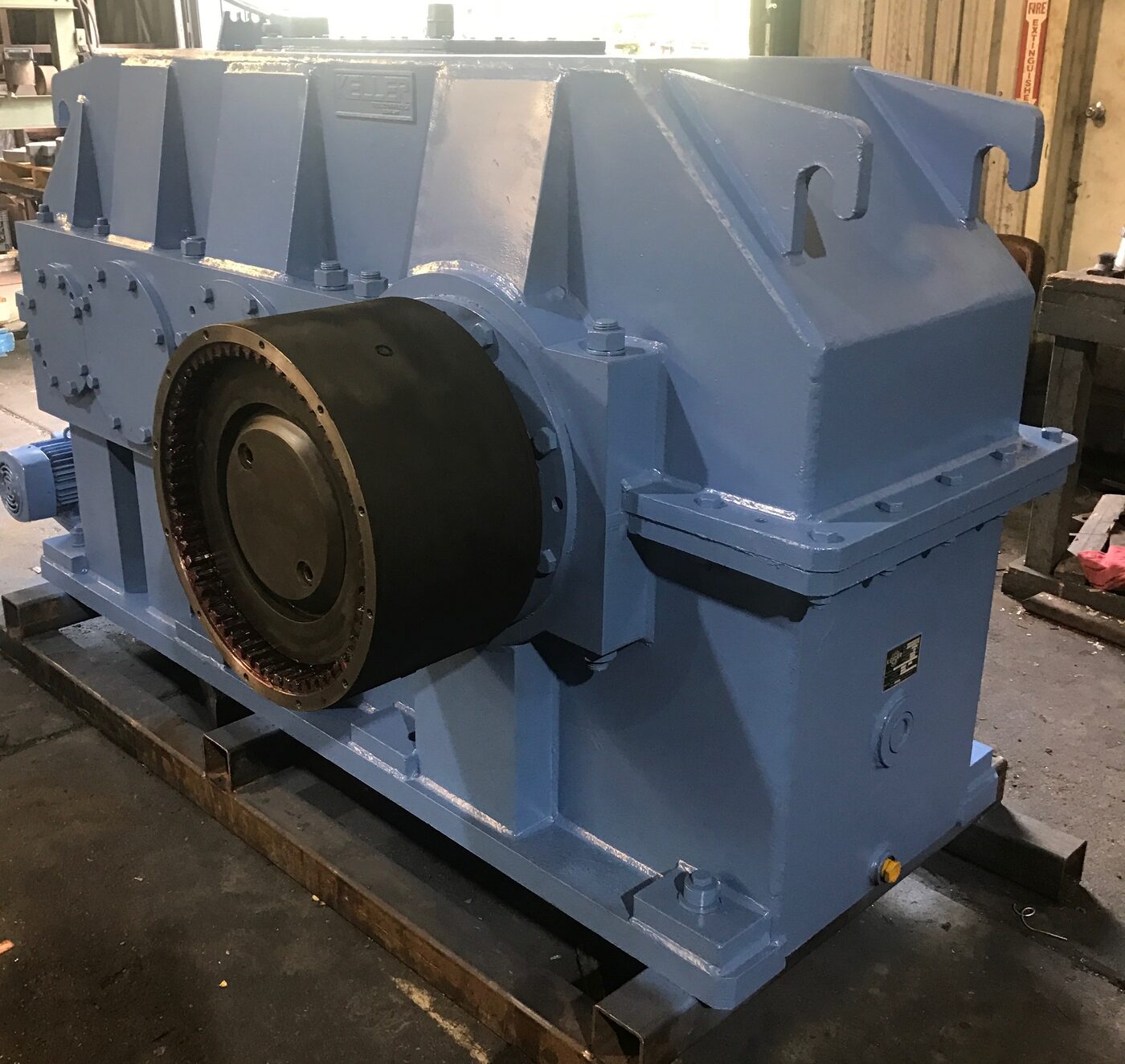 A large rebuilt blue gearbox with a heavy duty coupling installed