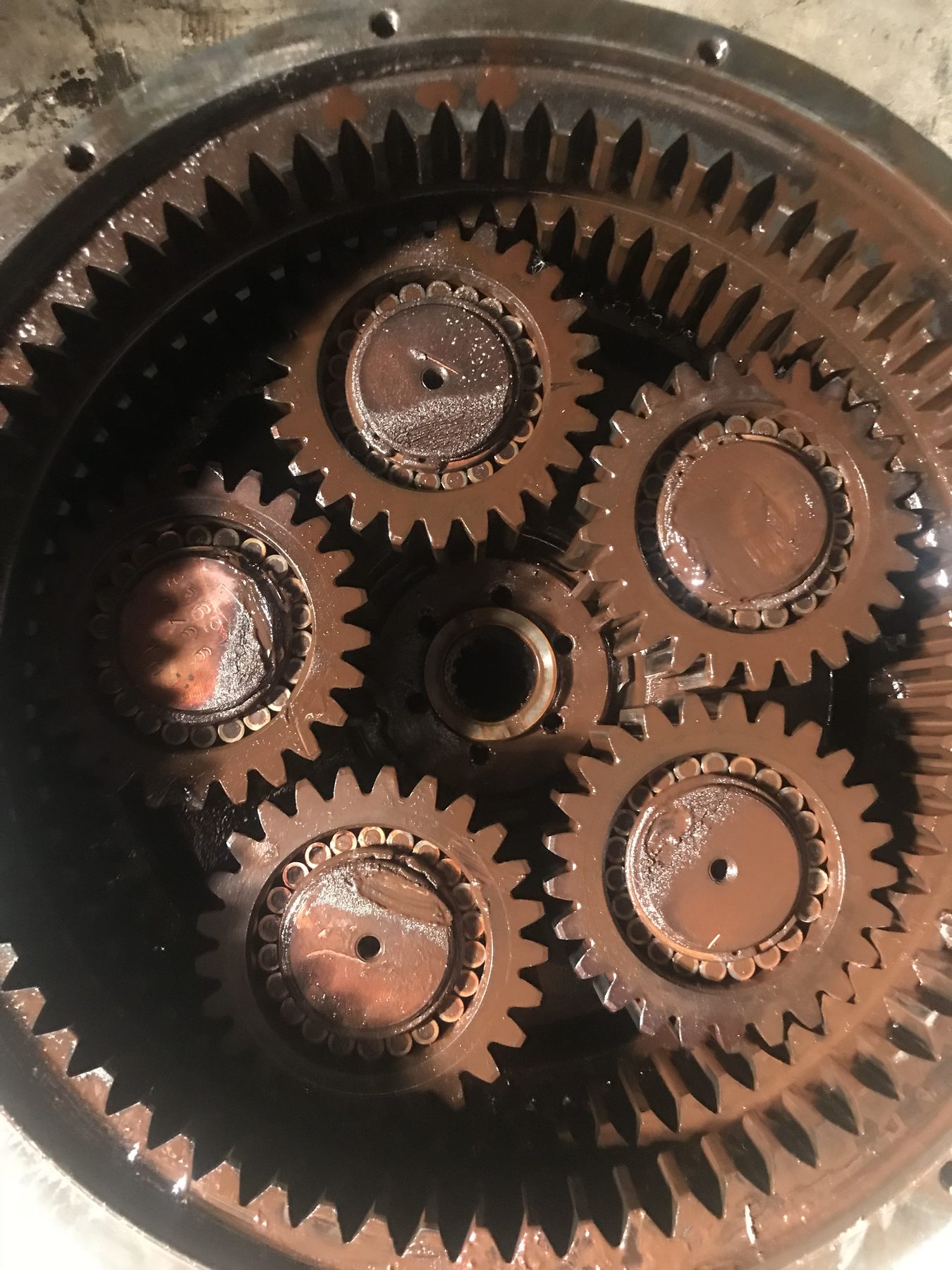 Inside view of a worn planetary gear set before repair