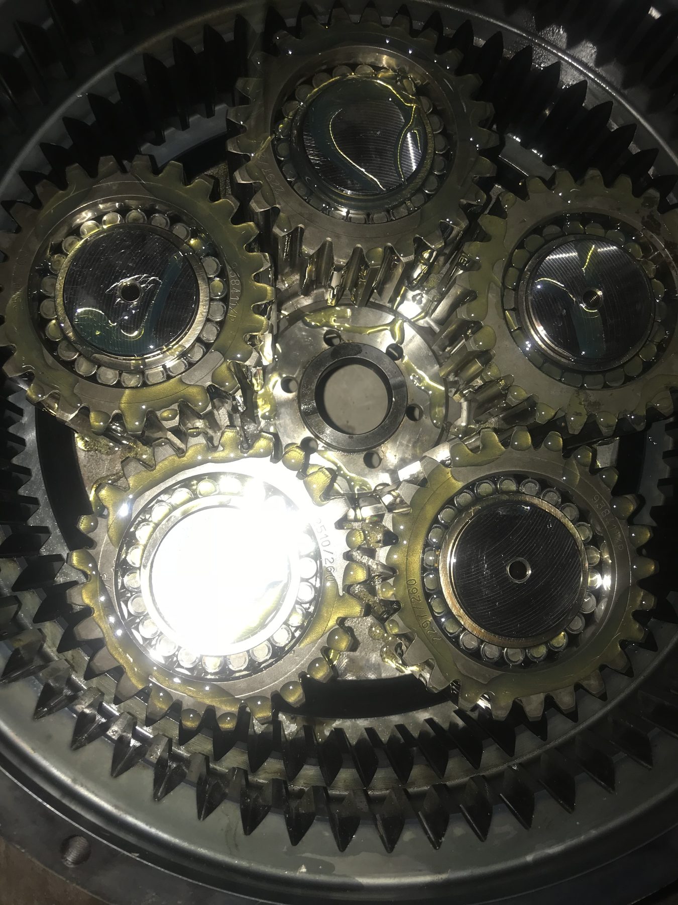 Inside view of a freshly rebuilt planetary gear set, clean and oiled