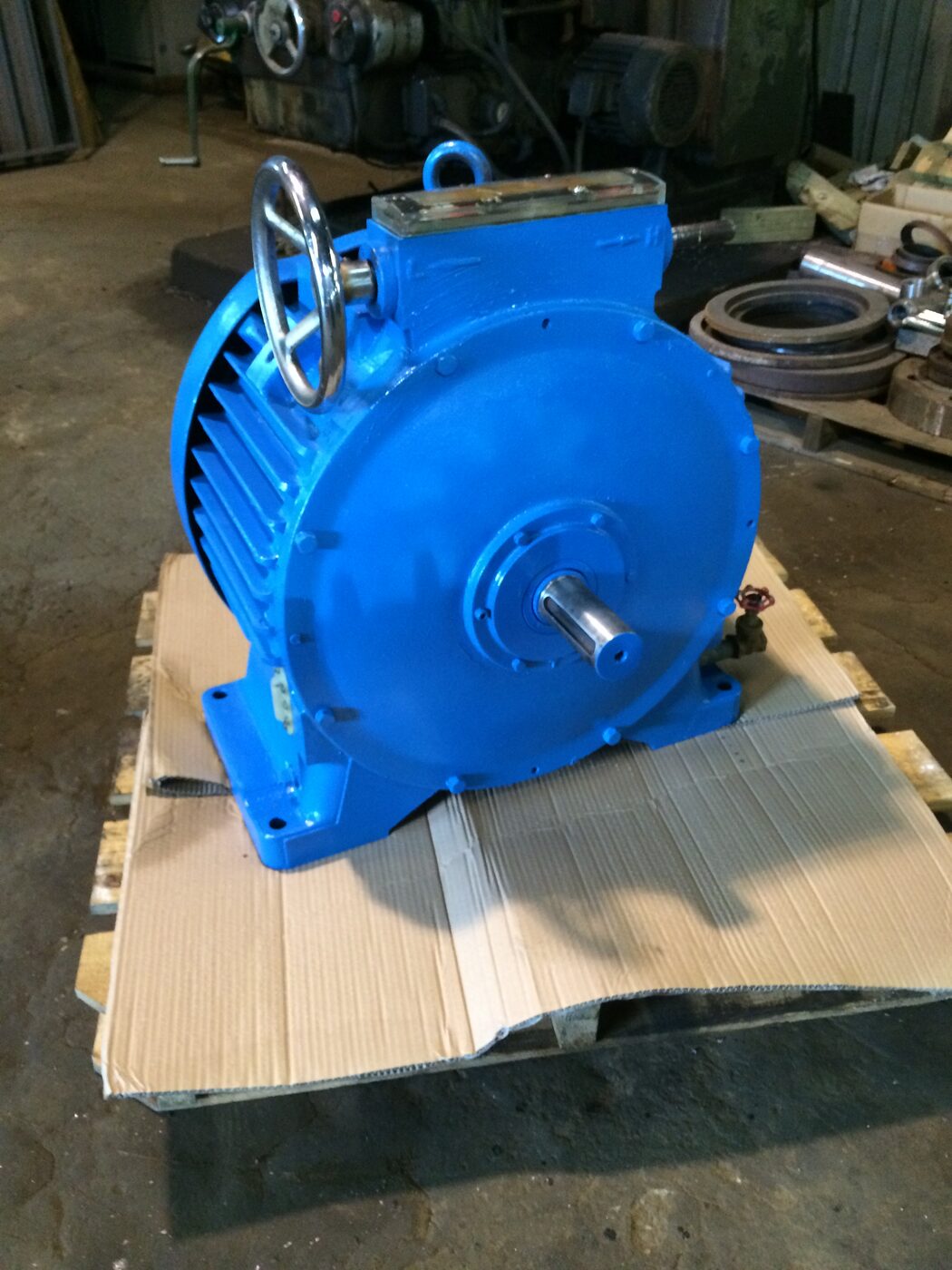 A rebuilt blue gearbox with its fan cover refitted