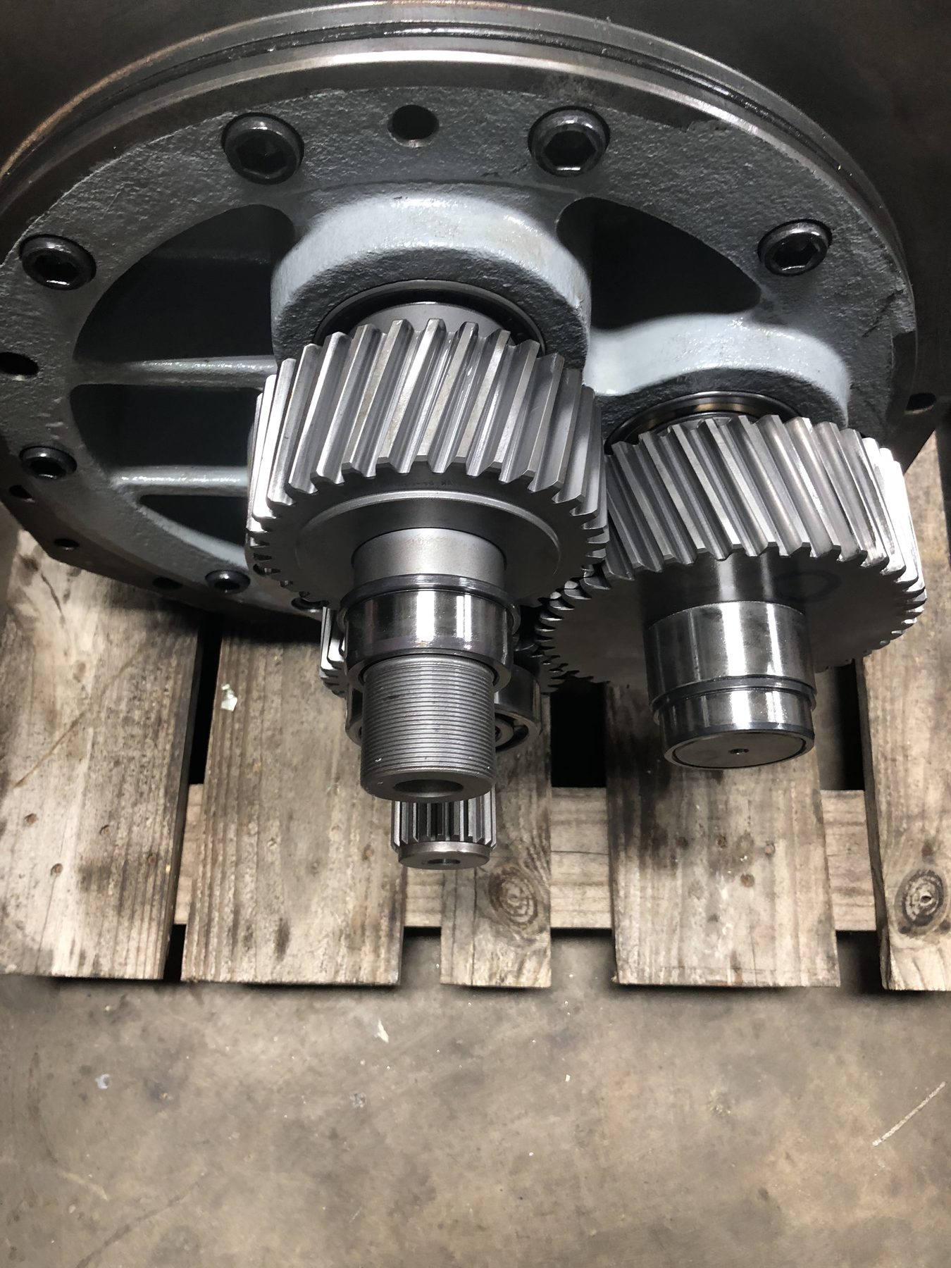 A rebuilt gearbox with two reconditioned helical pinion gears installed in the housing