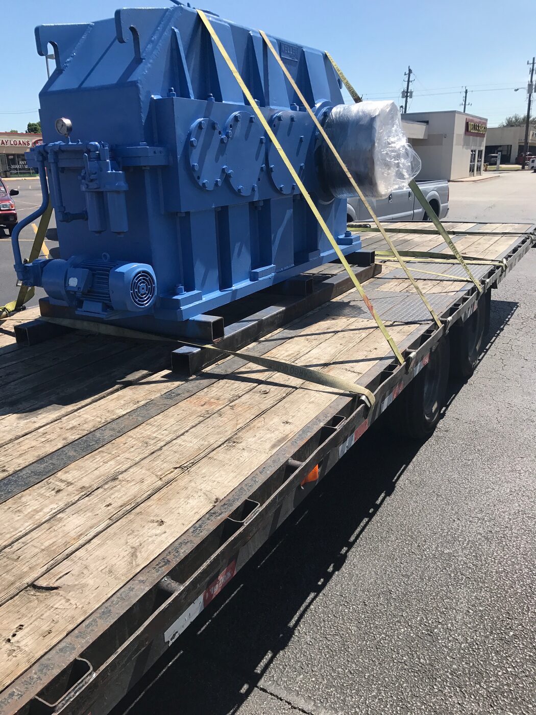 A rebuilt gearbox strapped down on a trailer for delivery